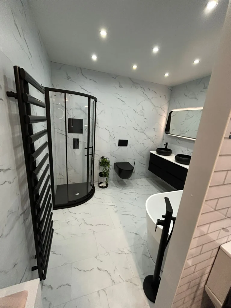 Modern bathroom design and installation featuring a walk-in shower and fitted vanity